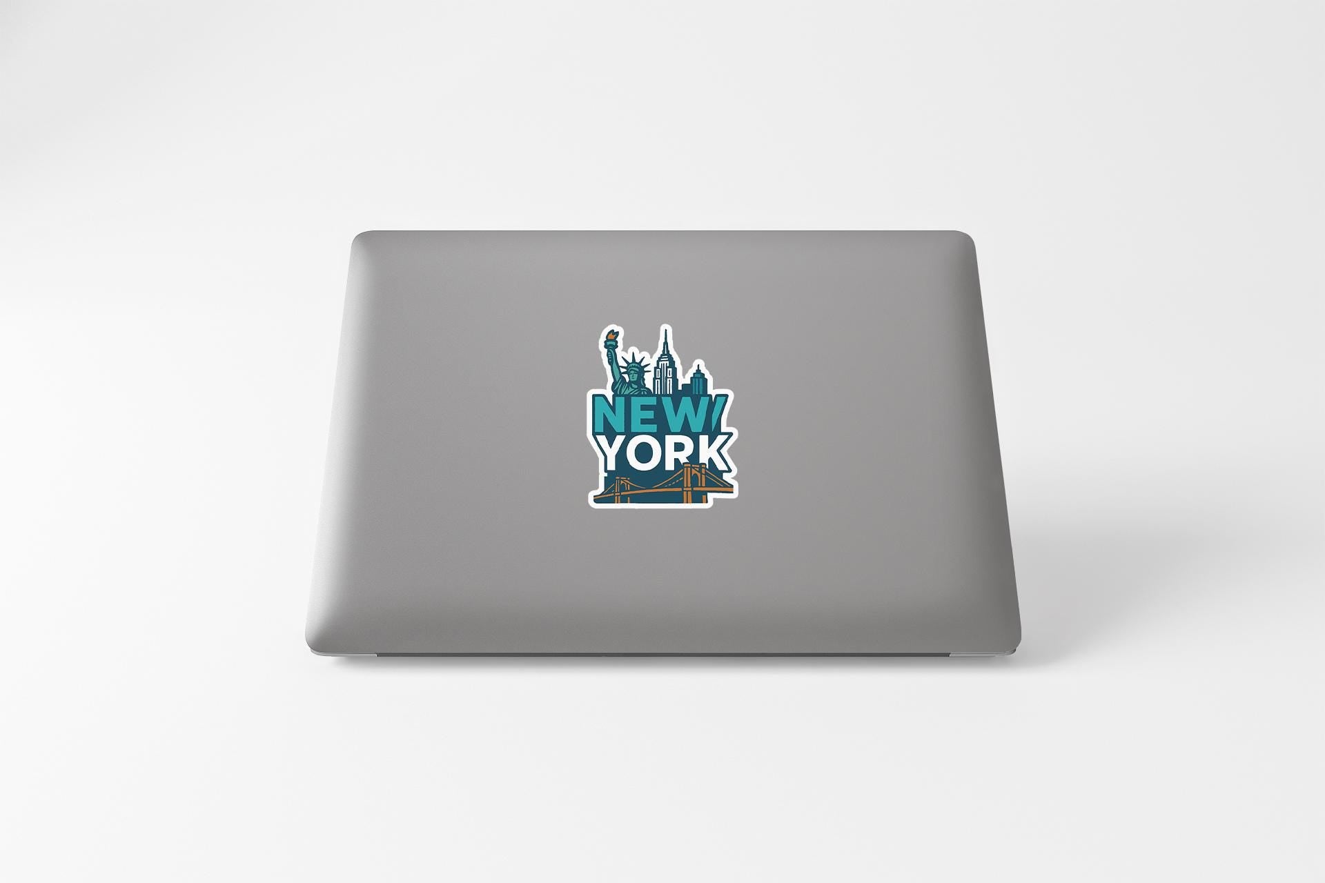a laptop with a new york sticker on it
