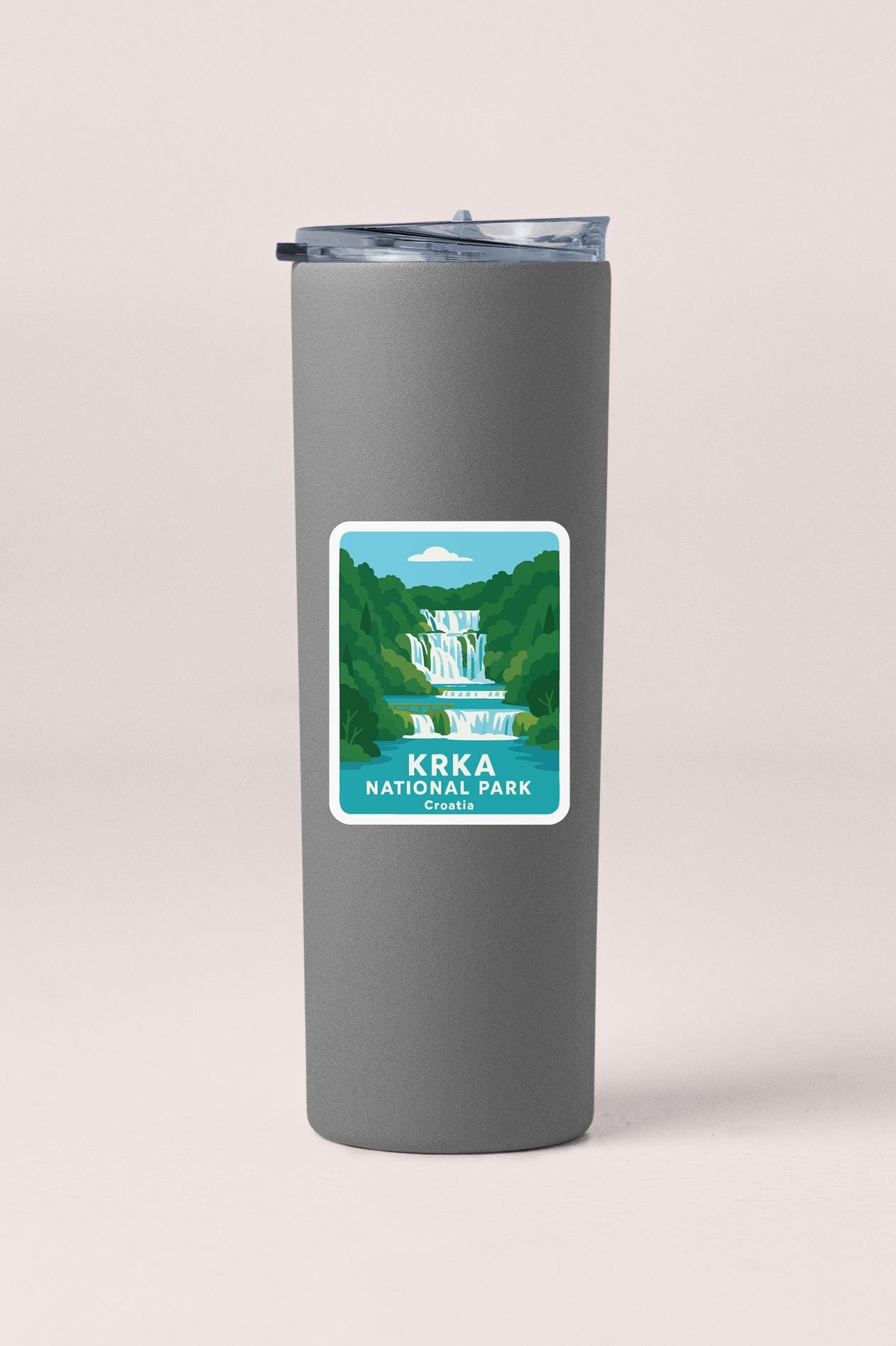 A gray cylindrical container with a label that features an illustration of a waterfall and the text "KRKA NATIONAL PARK, Croatia".