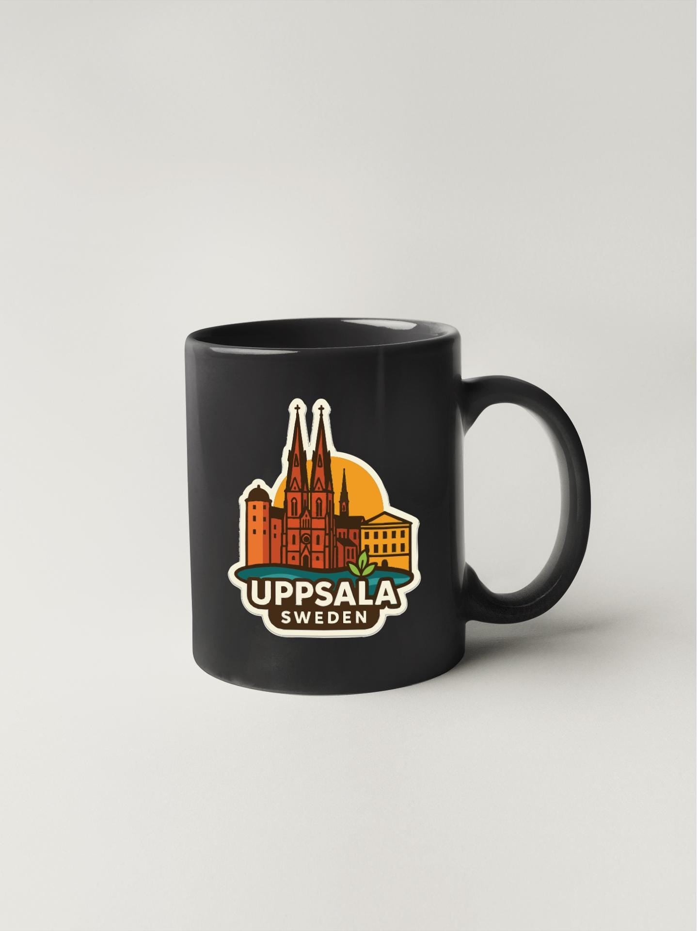 A black coffee mug with a colorful illustration of the Uppsala, Sweden skyline.