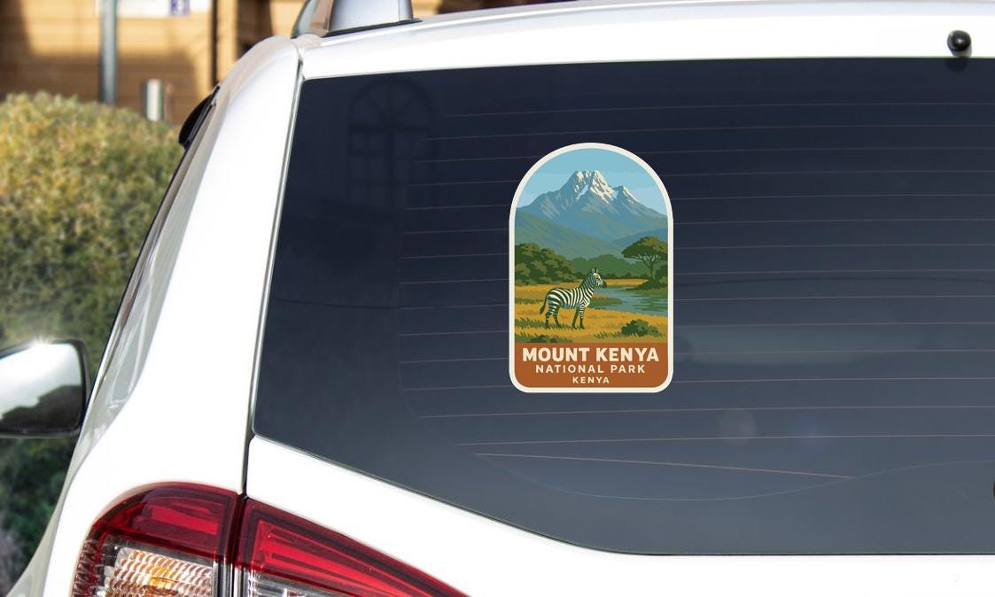 a sticker on the rear window of a car, depicting a zebra and the text "Mount Kenya National Park Kenya".