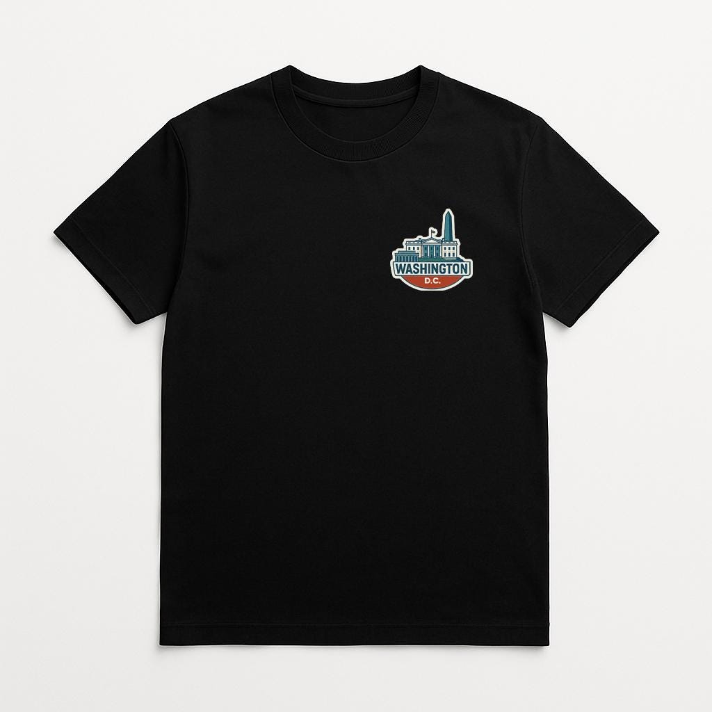 A black t-shirt with a graphic design on the front, depicting a city skyline with the text "WASHINGTON" prominently displayed.