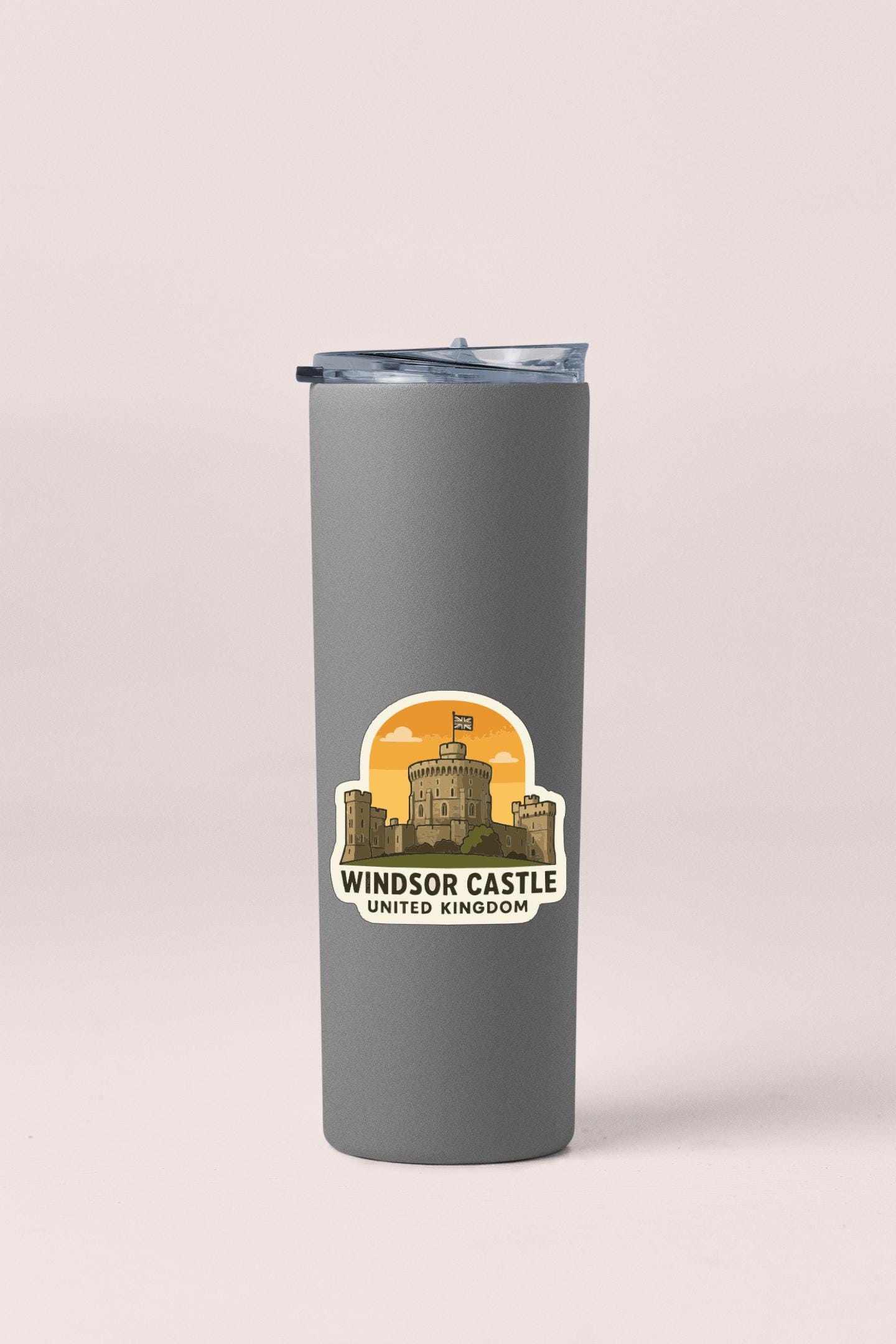 A gray insulated tumbler with a sticker depicting Windsor Castle, the United Kingdom.