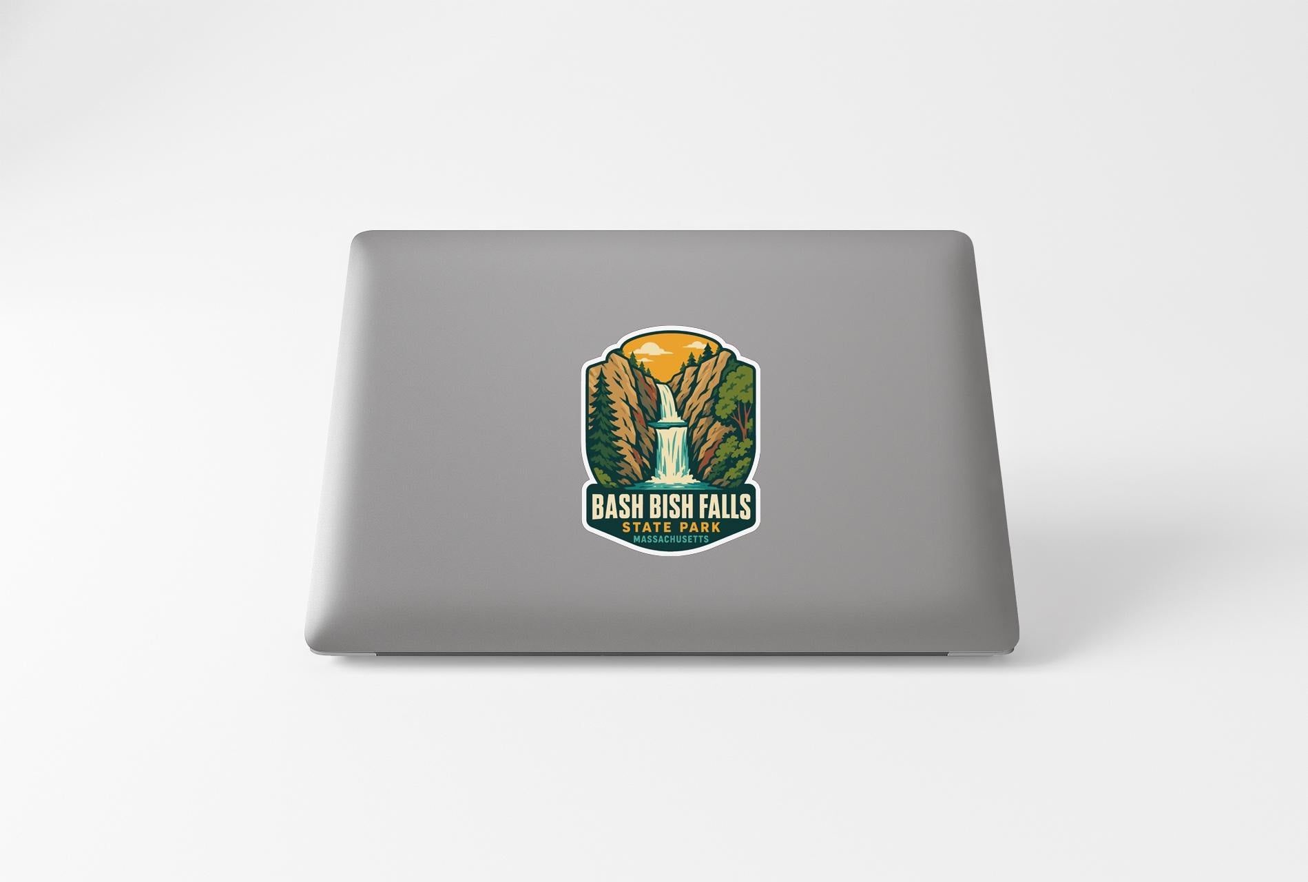 A sticker featuring a waterfall and the text "Bash Falls State Park" on the back of a laptop.