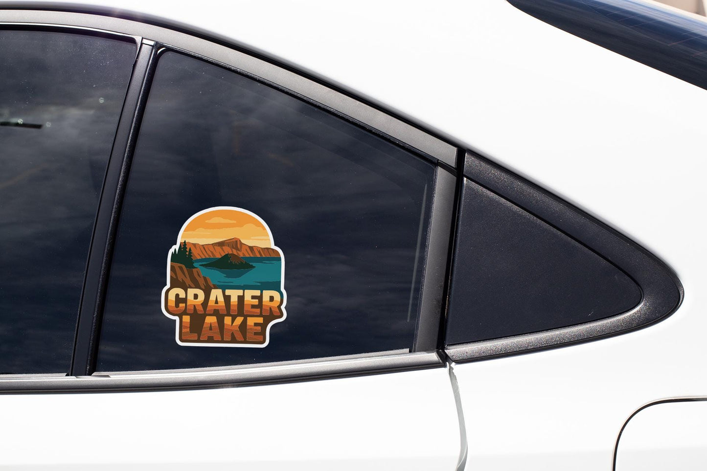 A sticker on the side of a car window that says "Crater Lake".
