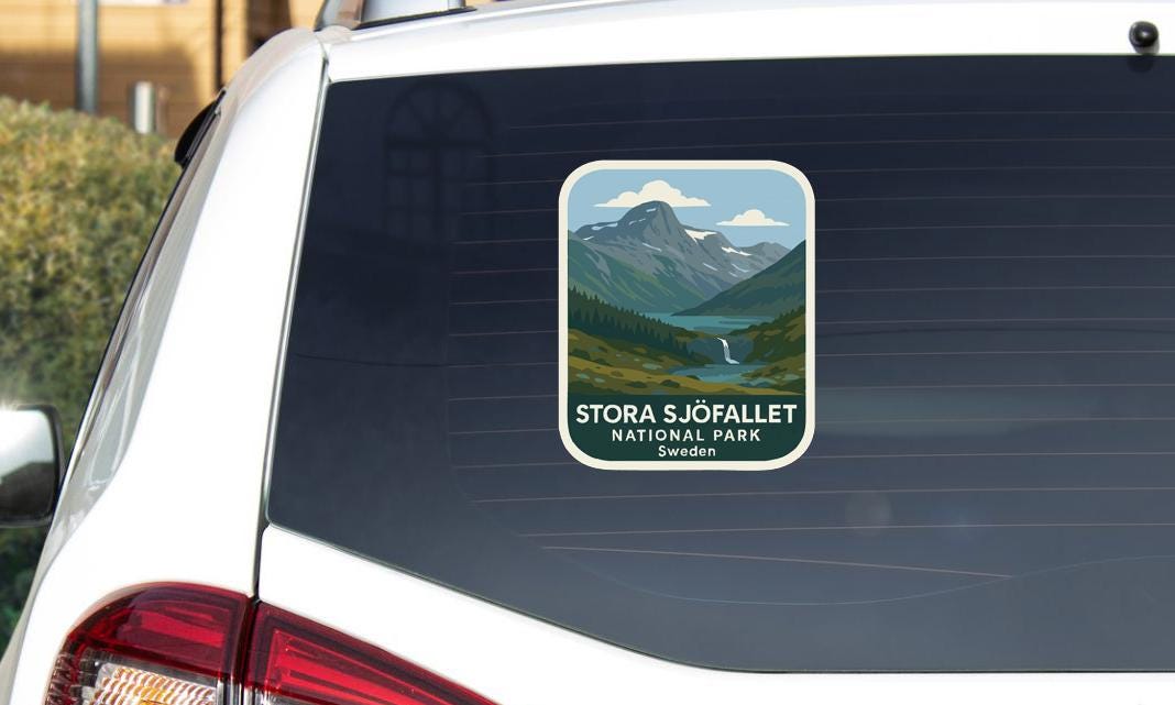 A sticker on the rear window of a car that says "STORA SJÖFALLET NATIONAL PARK SWEDEN".
