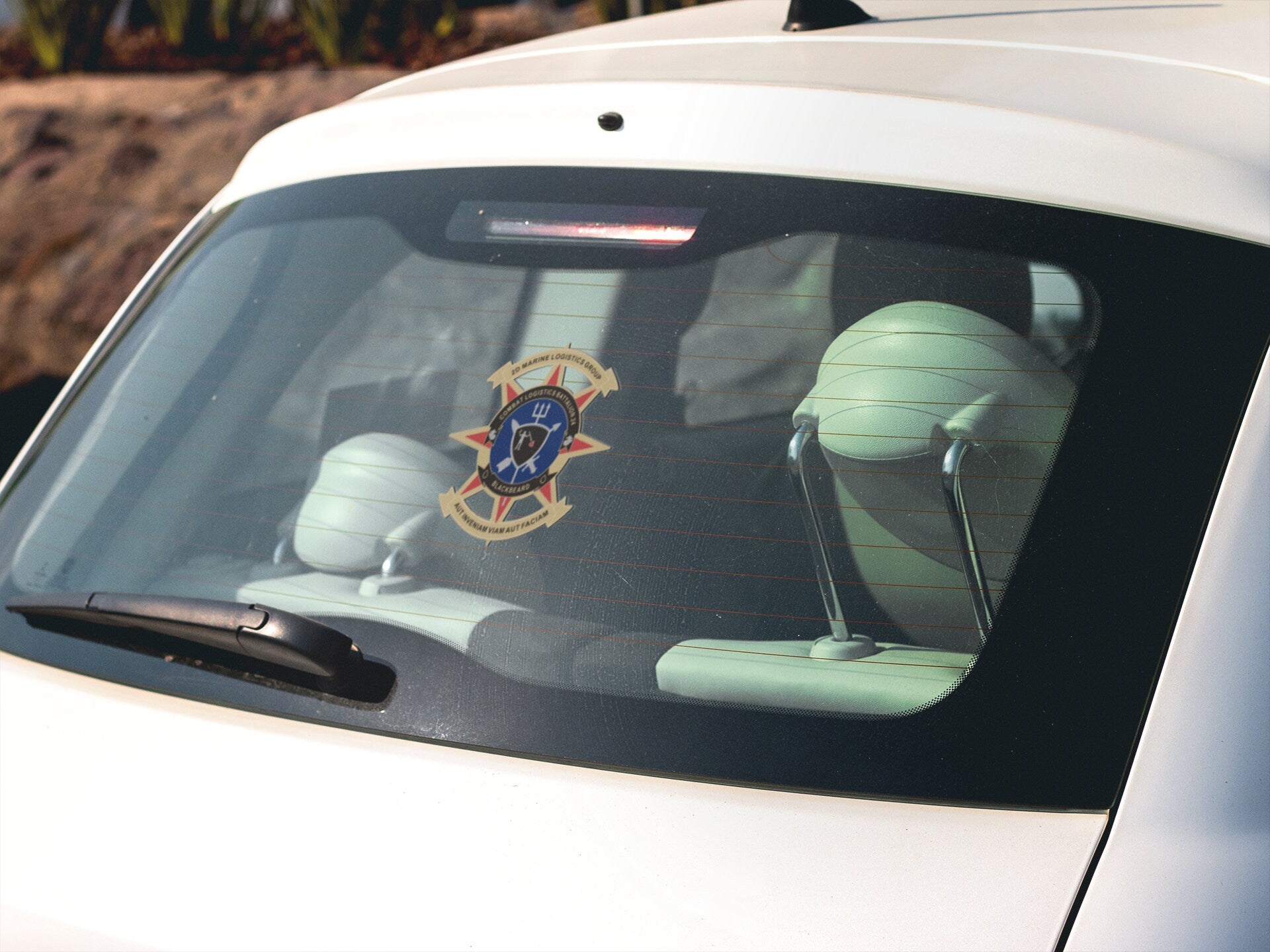 a car with a sticker on the back window