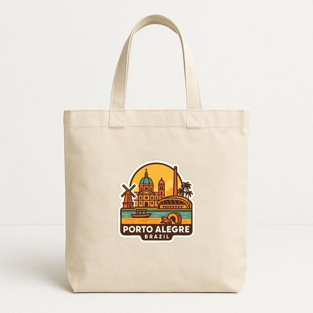 A beige tote bag with a graphic design depicting the cityscape of Porto Alegre, Brazil.