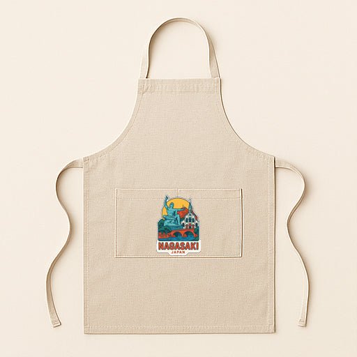 A beige apricot with a graphic design featuring a city skyline and the text "Nagasaki" printed on it.