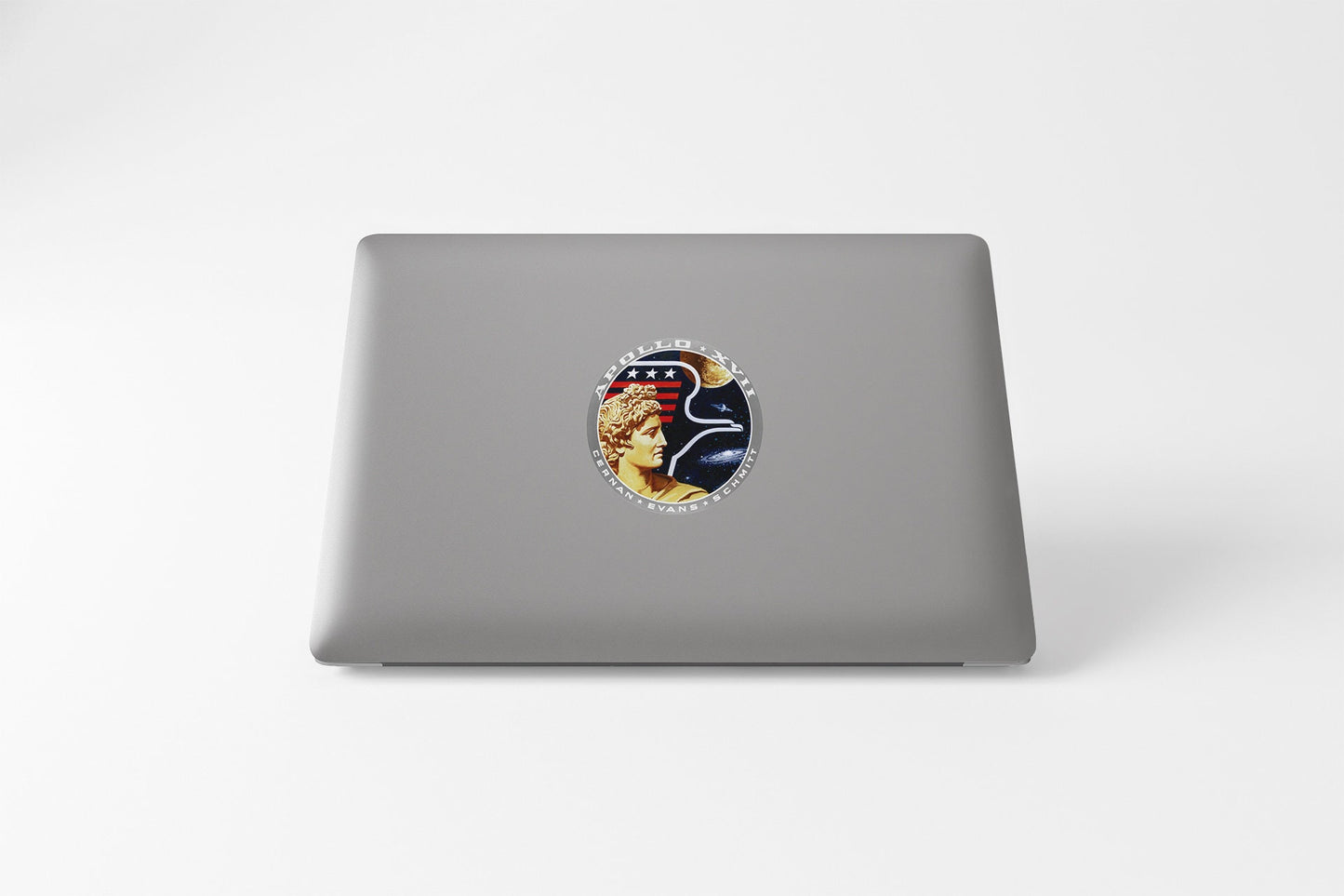 a laptop with a sticker of a woman's face