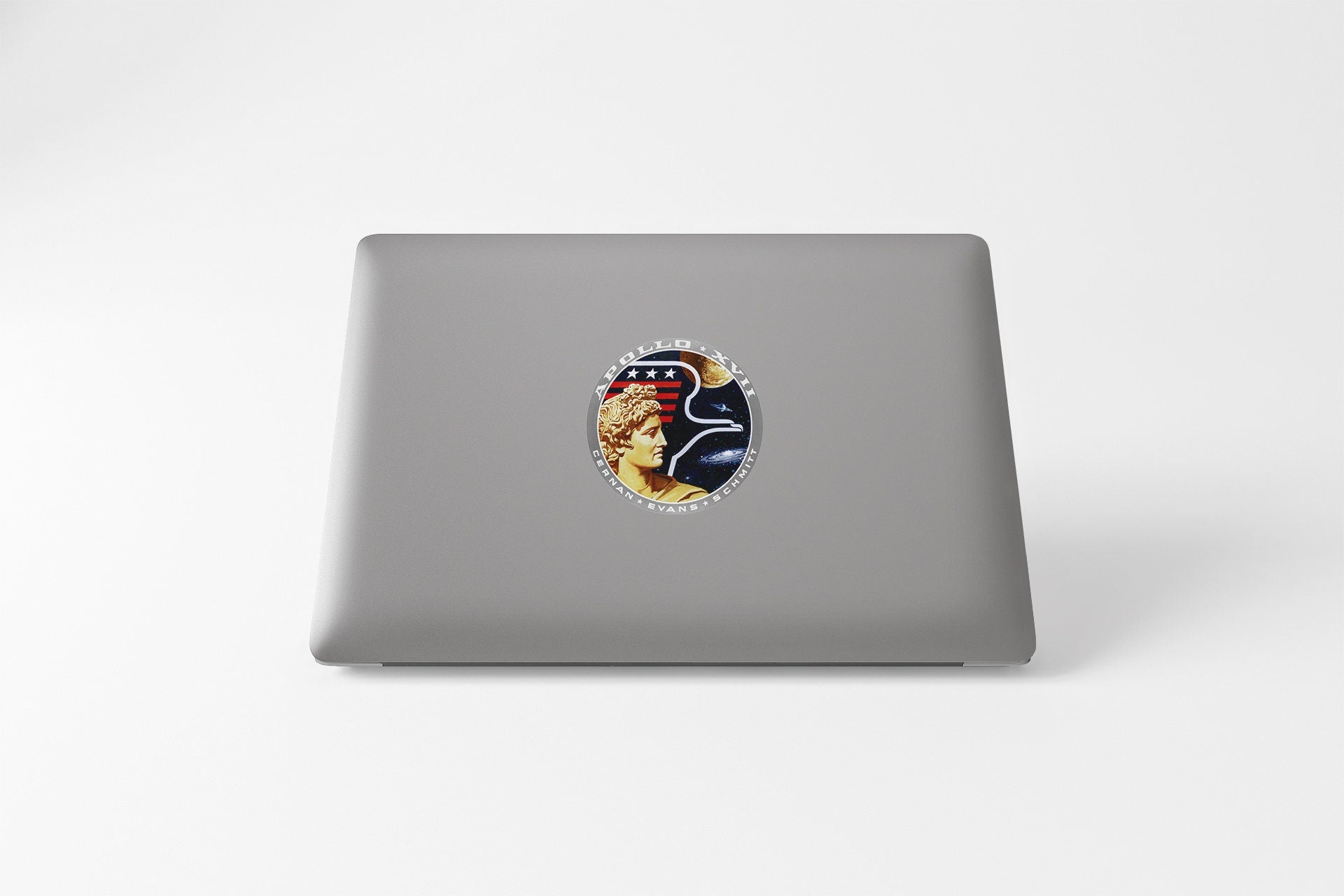 a laptop with a sticker of a woman's face