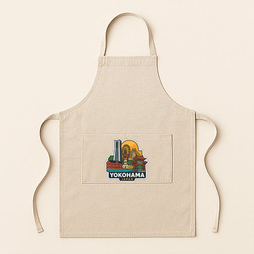 A beige apricot with a graphic design of a city skyline on it.