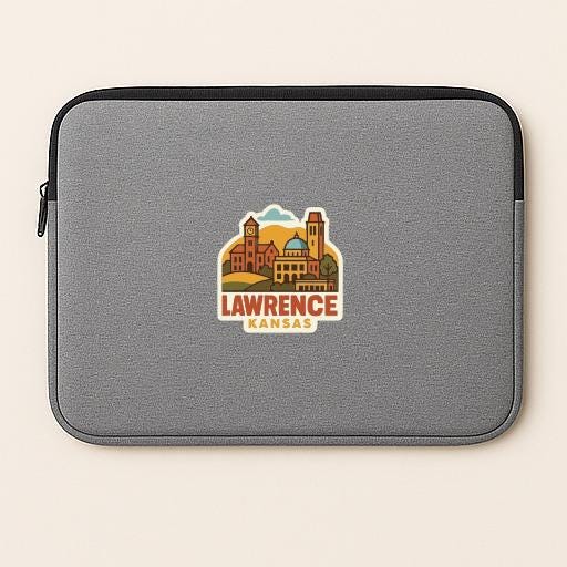 A gray laptop sleeve with a graphic of a city skyline and the text "LAWRENCE KANSAS" printed on it.
