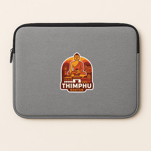A gray laptop sleeve with a sticker depicting a Buddha figure and the text "THIMPHU SHUAN" printed on it.
