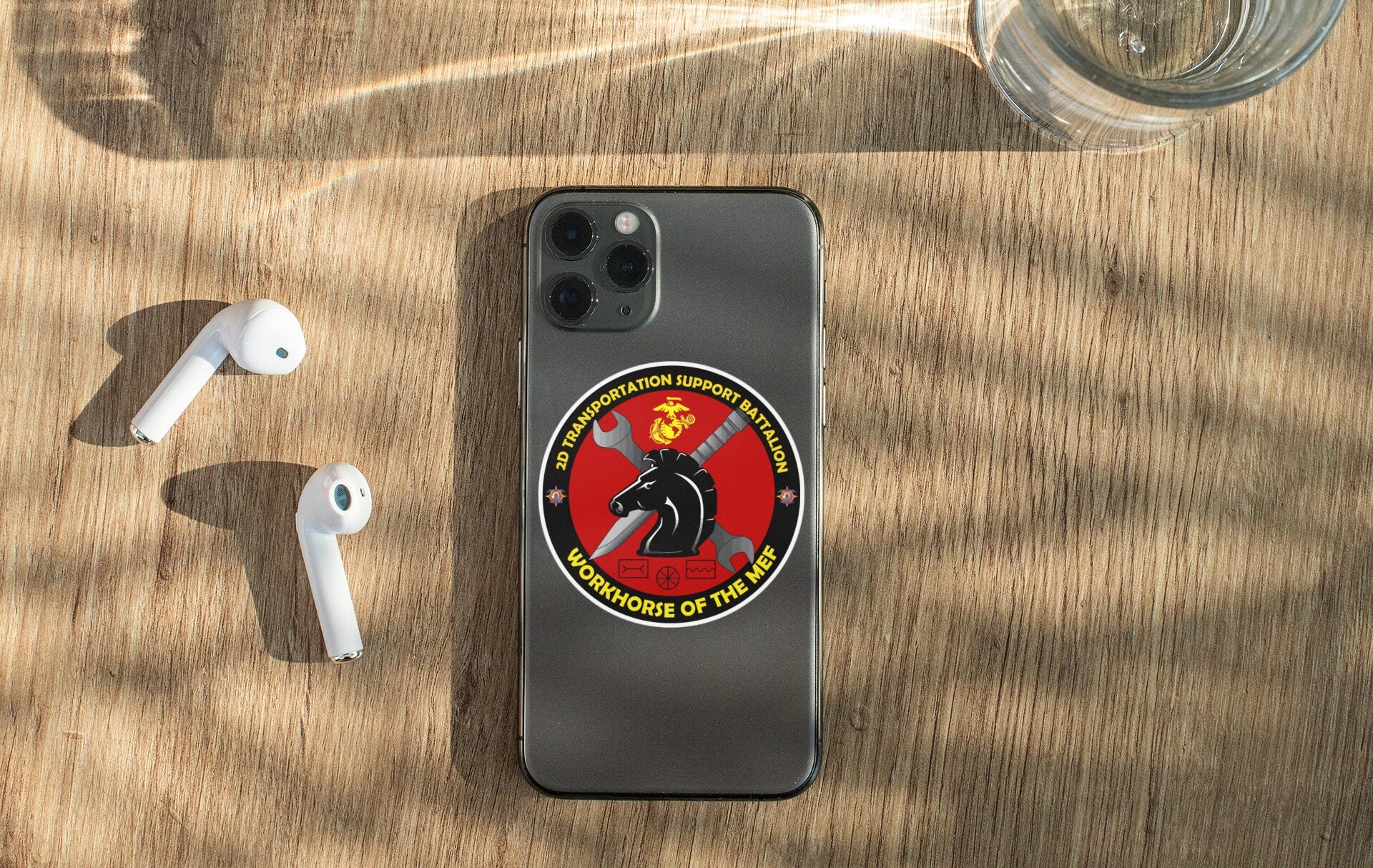 a cell phone sitting on top of a wooden table