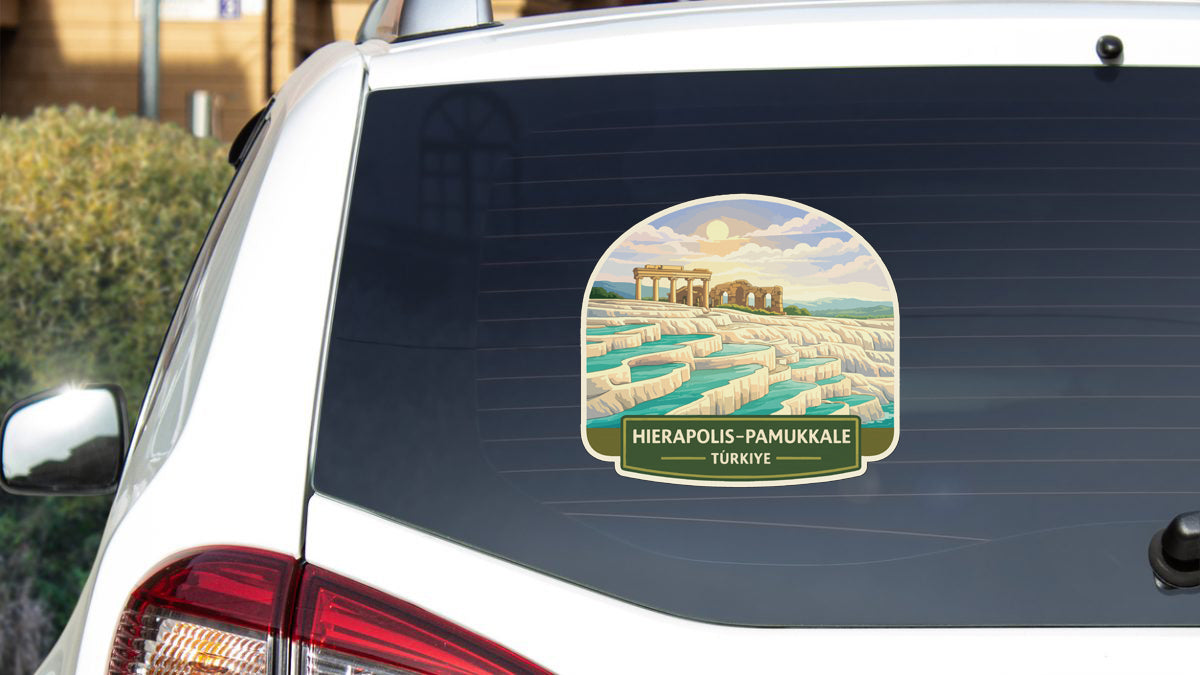 a sticker on the rear window of a car, depicting a scenic landscape with a body of water and a building in the background.