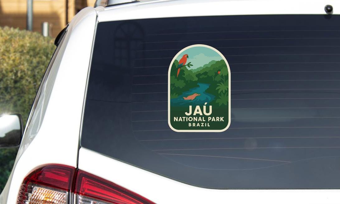A sticker on the rear window of a car that says "Jau National Park Brazil".