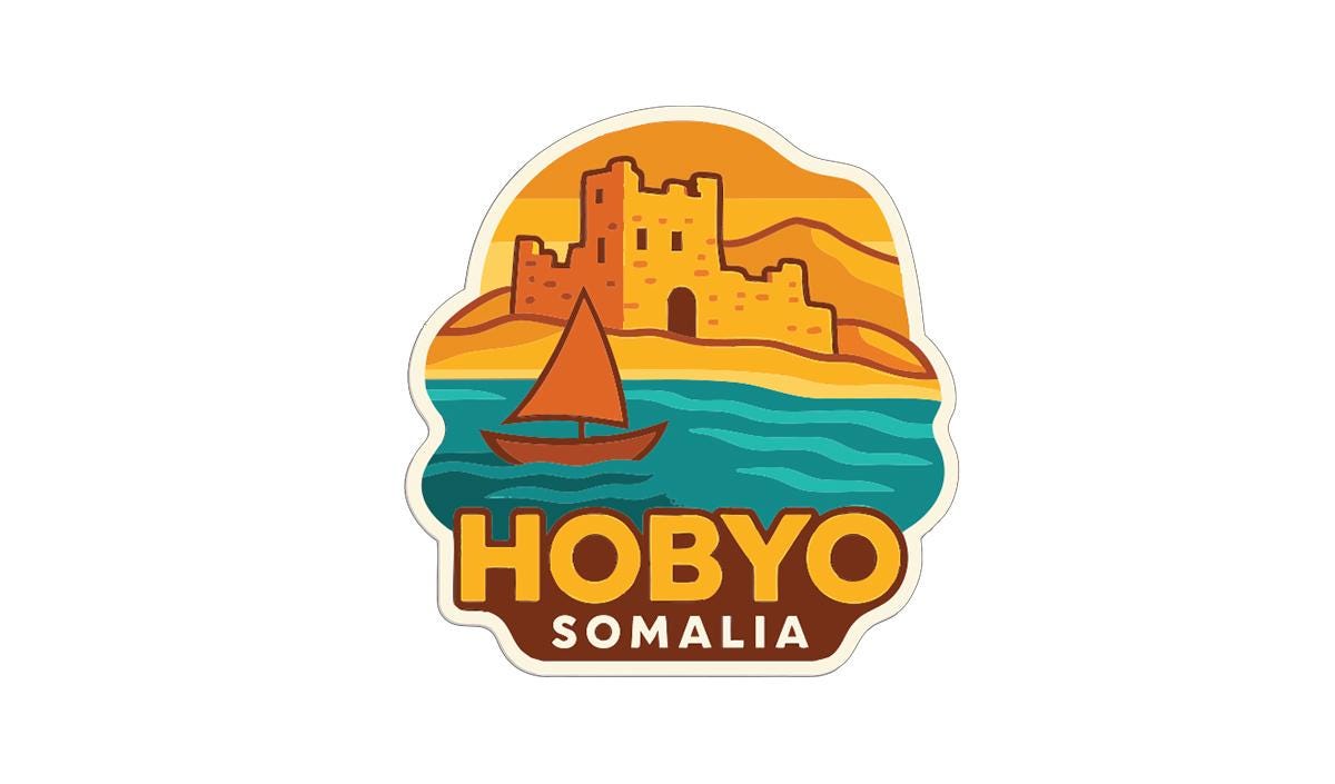 A sticker or logo depicting a castle on a hill overlooking a body of water, with a sailboat in the foreground. The text "HOBBYOMALIA" is prominently displayed, indicating the location or theme of the image.