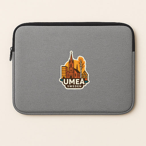A gray laptop sleeve with a sticker depicting a city skyline and the text "UMEA SWEDEN".