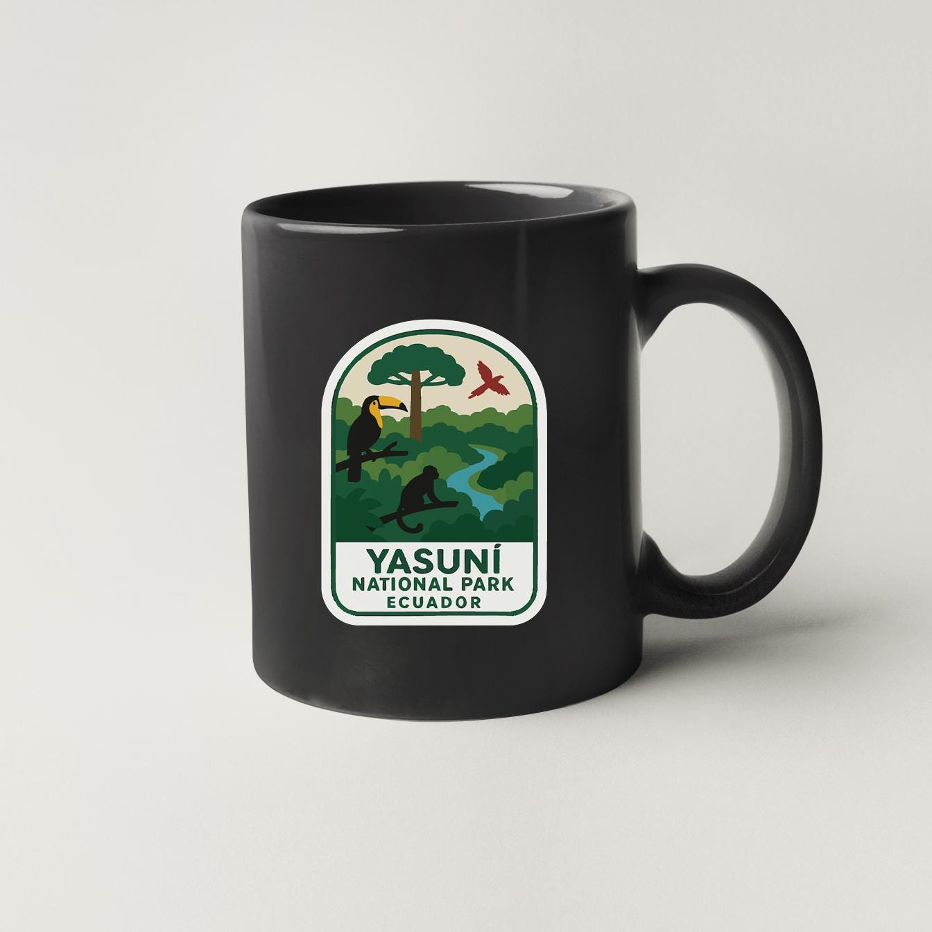 A black coffee mug with a green and white label that says "Yasuni National Park Ecuador".