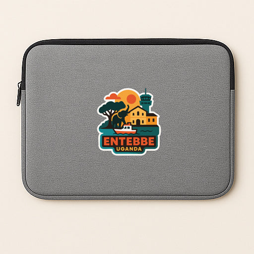 A gray laptop sleeve with a colorful logo depicting a building, tree, and sunset, along with the text "ENTEBBE UGANDA".