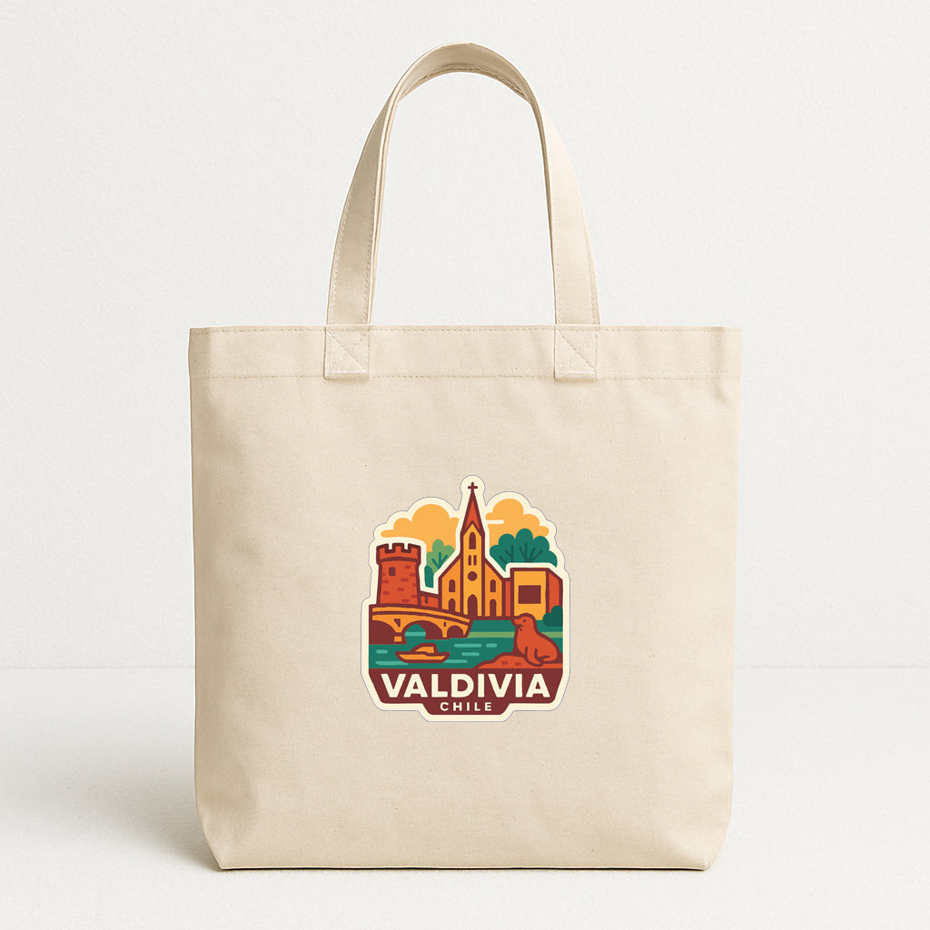 A beige tote bag with a printed design of a cityscape and the text "VALIDIVIA CHILE" printed on it.