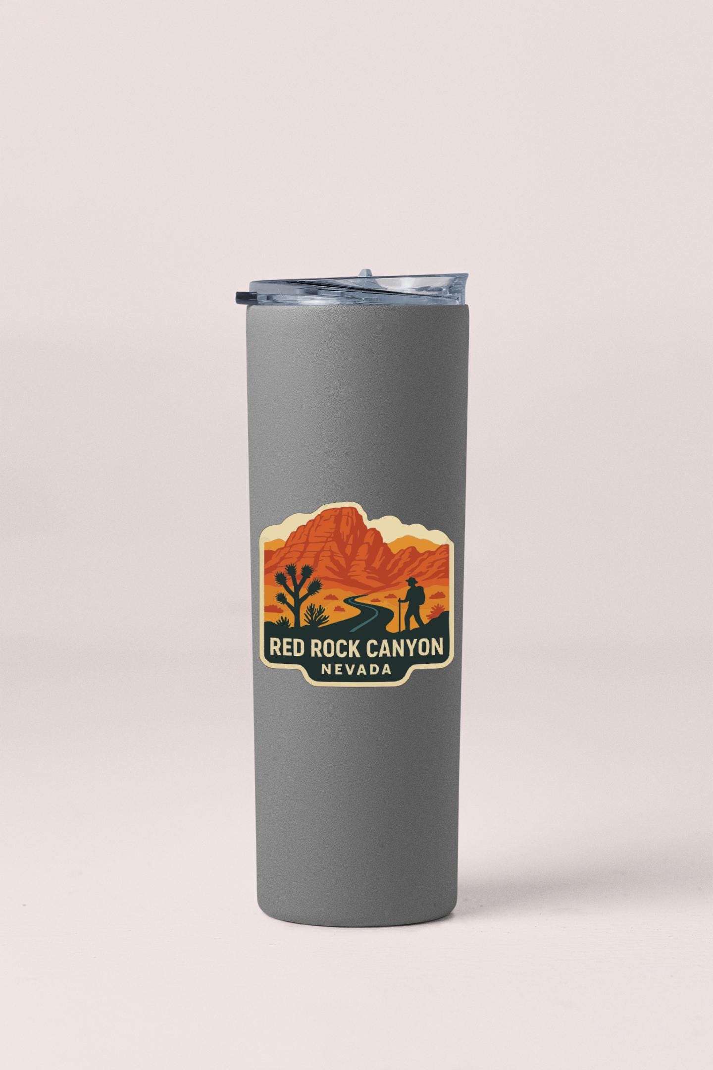 A gray tumbler with a label that says "RED ROCK CANYON NEVADA" on it.