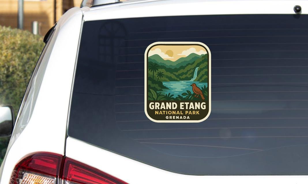 A sticker on the rear window of a car that says "GRAND ETANG NATIONAL PARK Grenada".