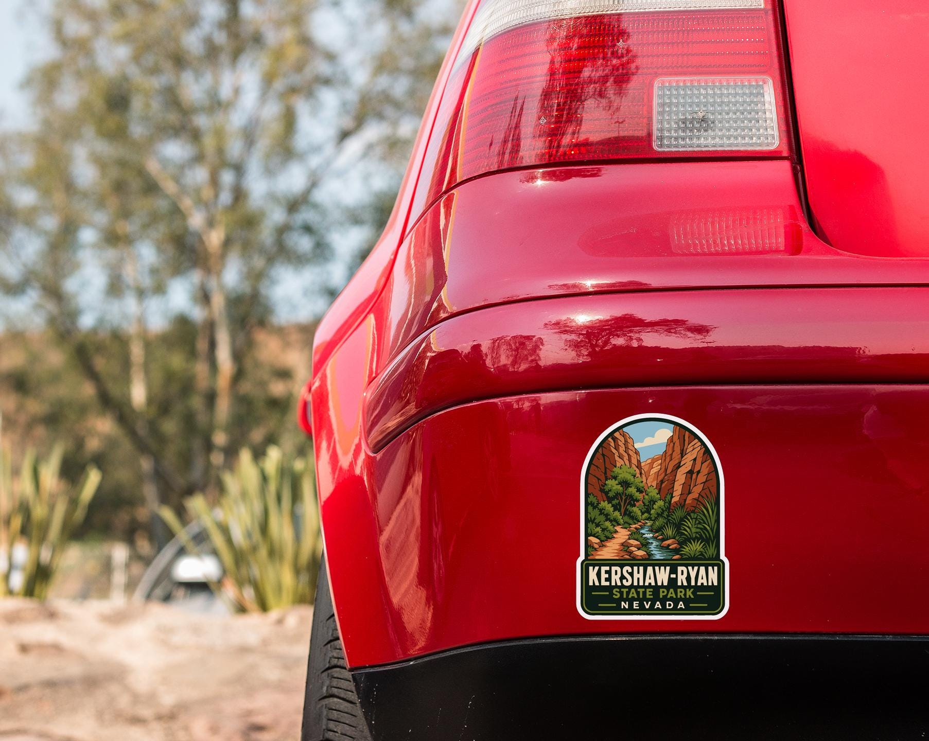the rear end of a red car with a sticker on the back window that reads "KERSHAW-RYAN NEVADA".