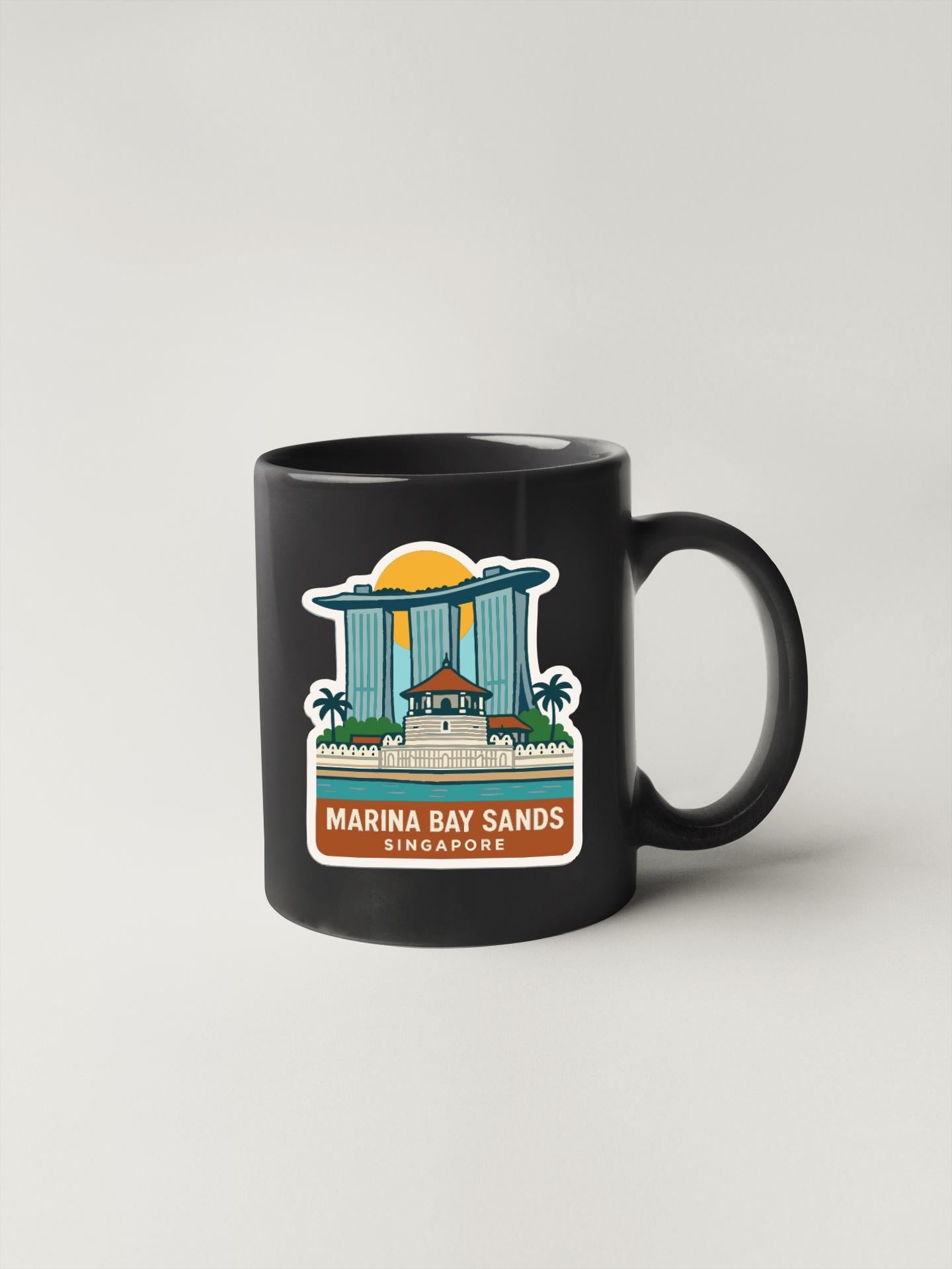 A black coffee mug with a graphic design depicting the Marina Bay Sands hotel in Singapore.