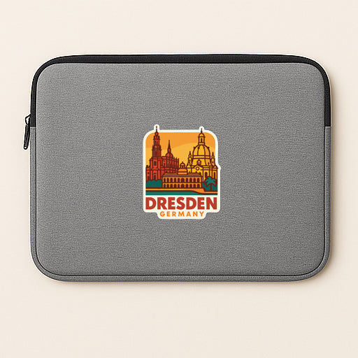 A gray laptop sleeve with a sticker of Dresden, Germany, printed on it.