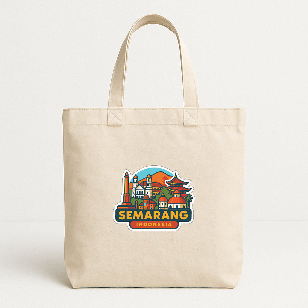 A beige tote bag with a colorful graphic of Semarang, Indonesia, printed on it.