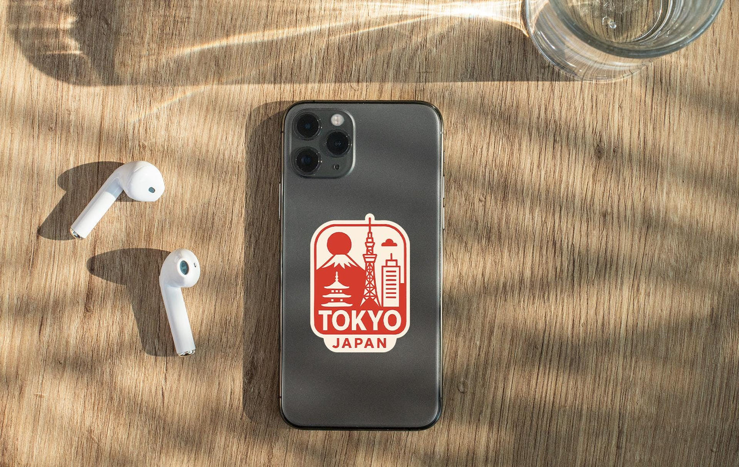 a phone and ear buds sitting on a table