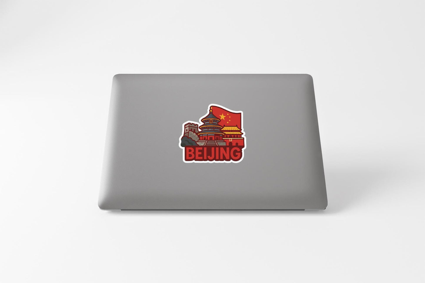 a laptop computer with a sticker of a man playing the piano