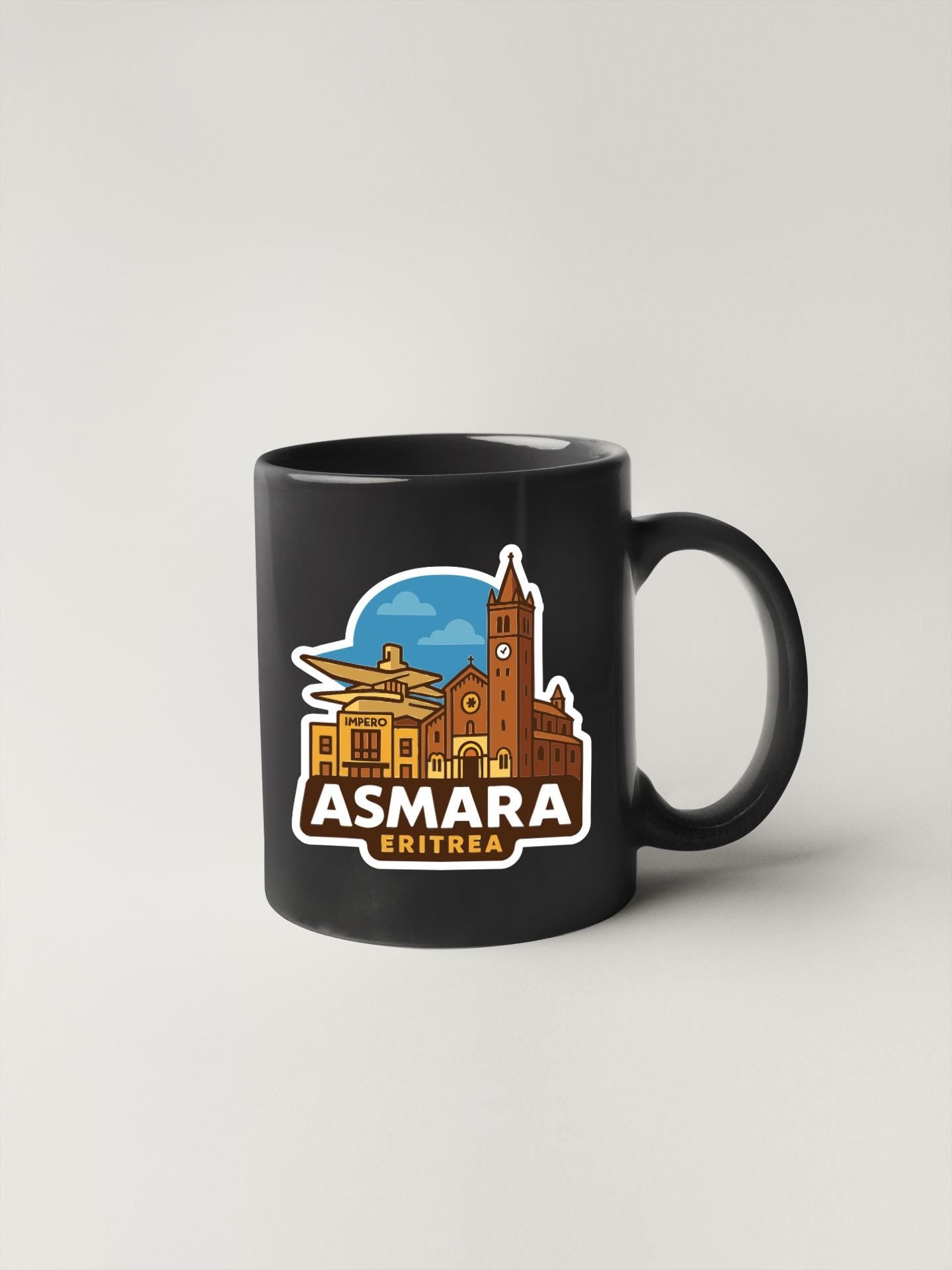 A black coffee mug with a stylized illustration of a city skyline and the text "ASMARA" prominently displayed.
