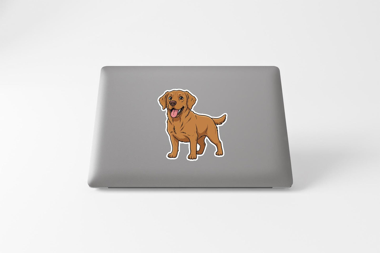 A sticker of a cartoon dog on the back of a laptop computer.