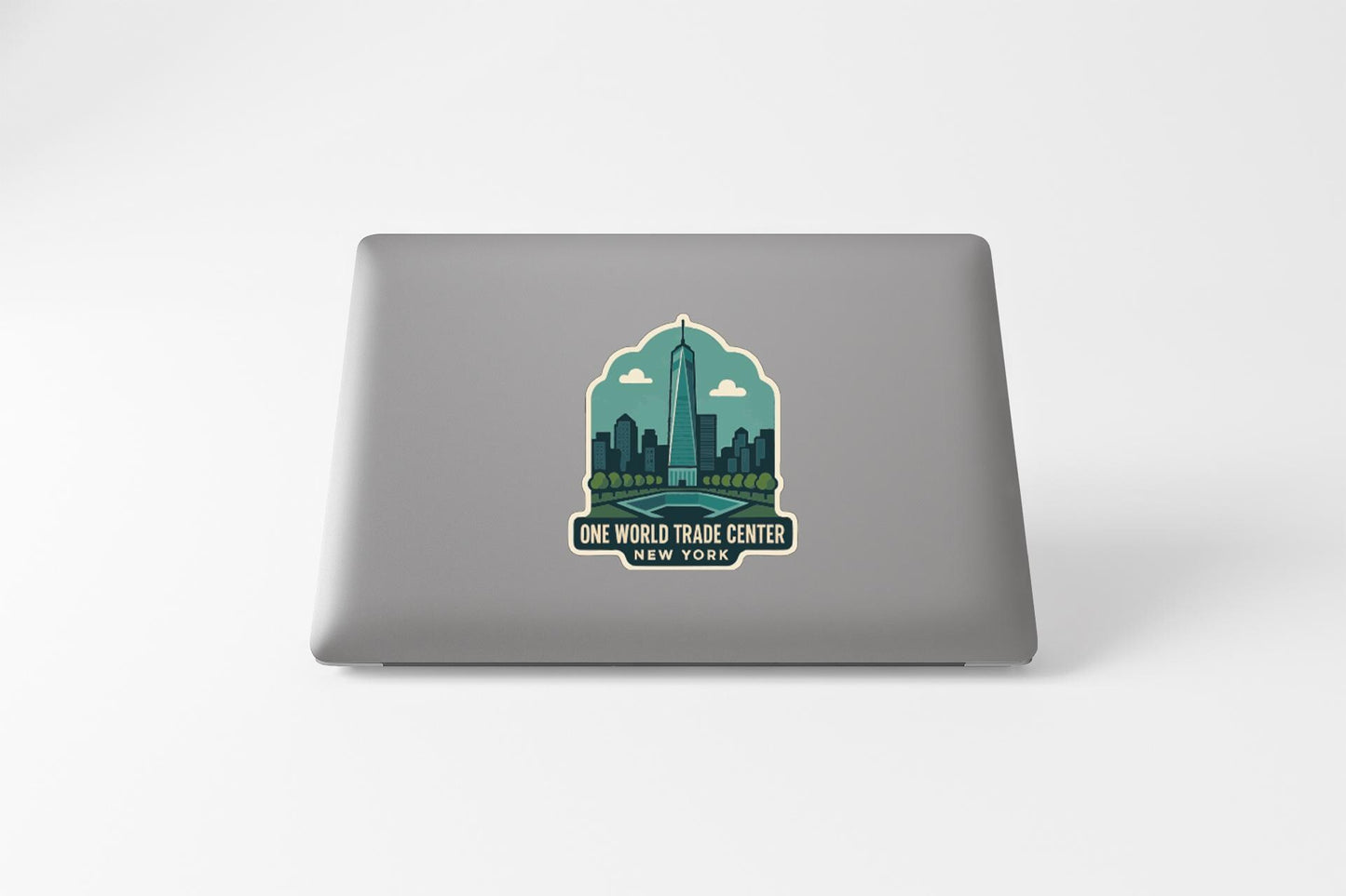a sticker or decal of the One World Trade Center in New York City, with a stylized illustration of the skyscraper and surrounding cityscape.