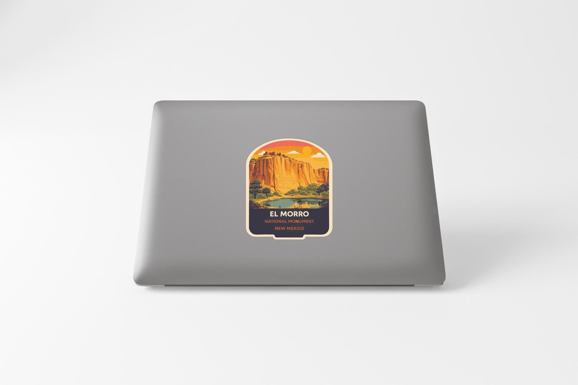 a sticker with a scenic landscape of a mountain and a lake, along with the text "EL MORO" and "NEW MEXICO".