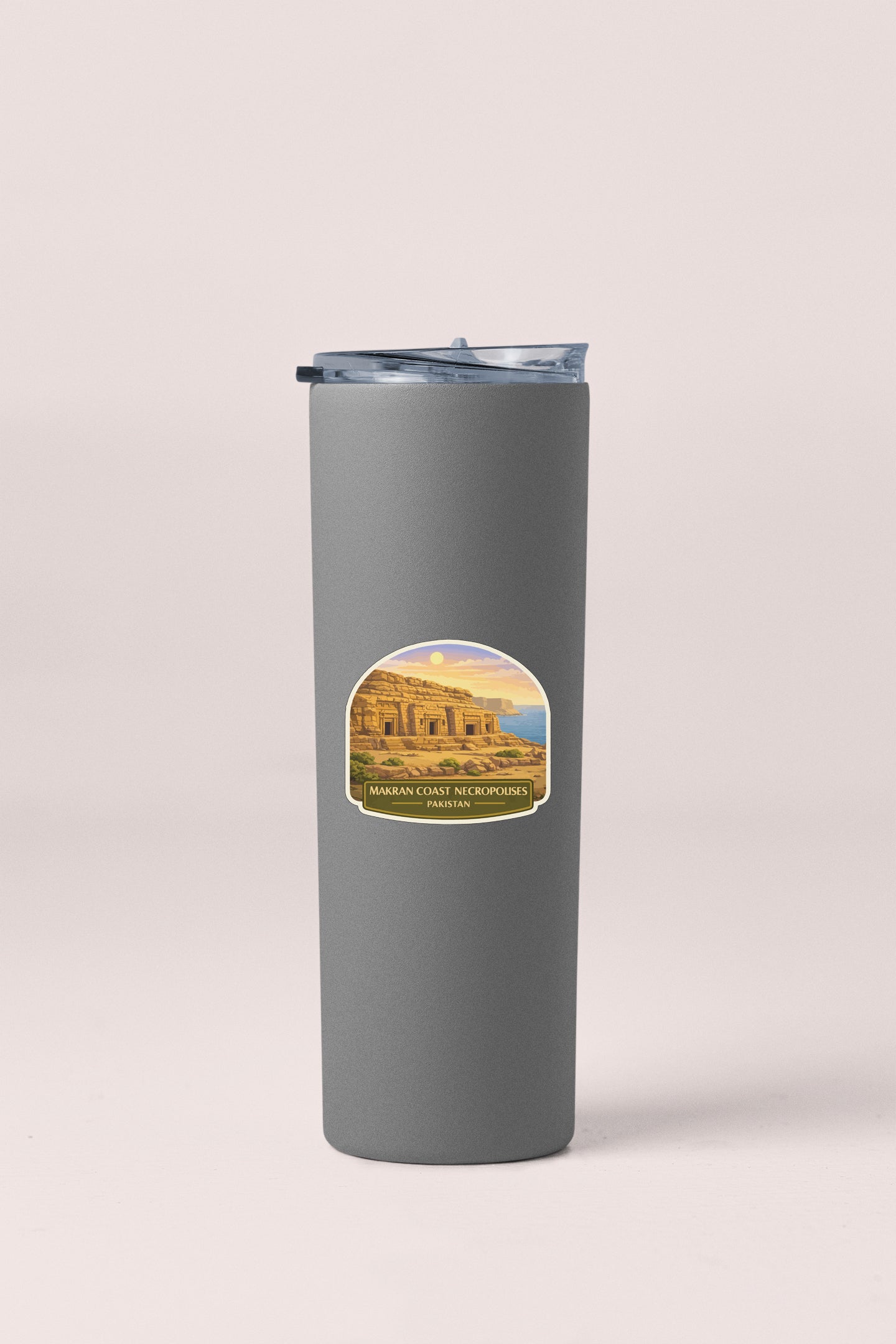 A gray insulated tumbler with a label featuring an image of the Maran Coast Microwave ovens in Pakistan.