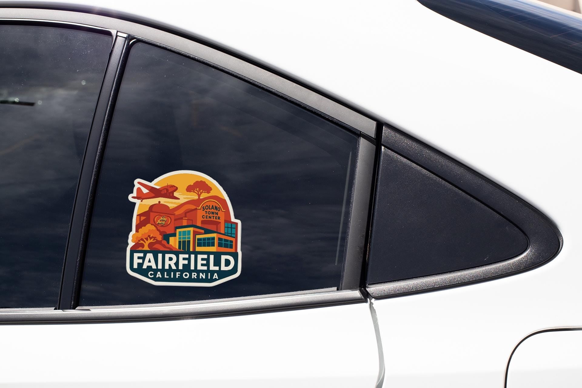 A sticker on the side of a car window, depicting a scenic view of Fairfield, California.