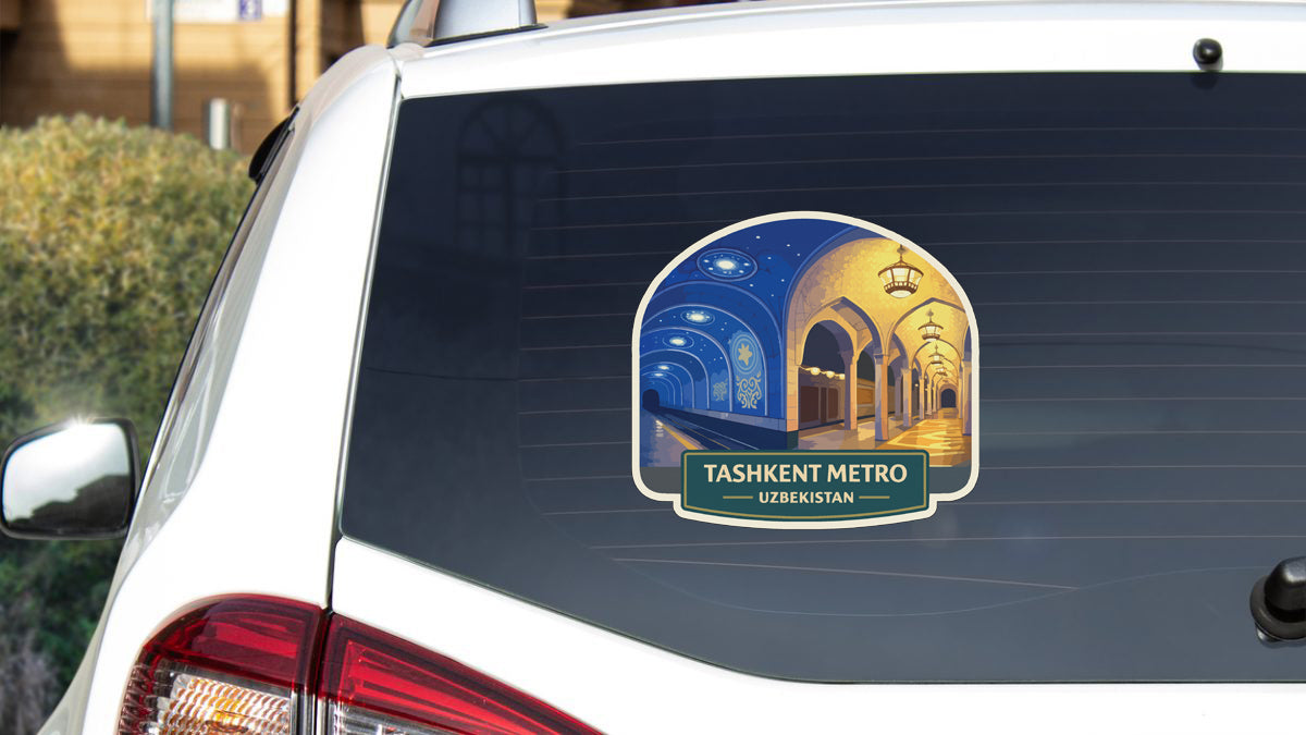a sticker on the rear window of a car that displays a night scene of a train station.