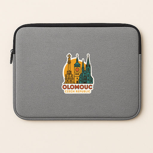 A gray laptop sleeve with a graphic design featuring the skyline of Olomouc, Czech Republic.