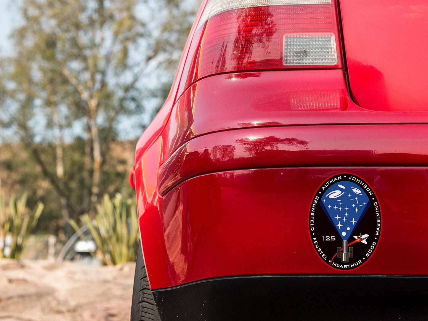 a close up of the rear end of a red car
