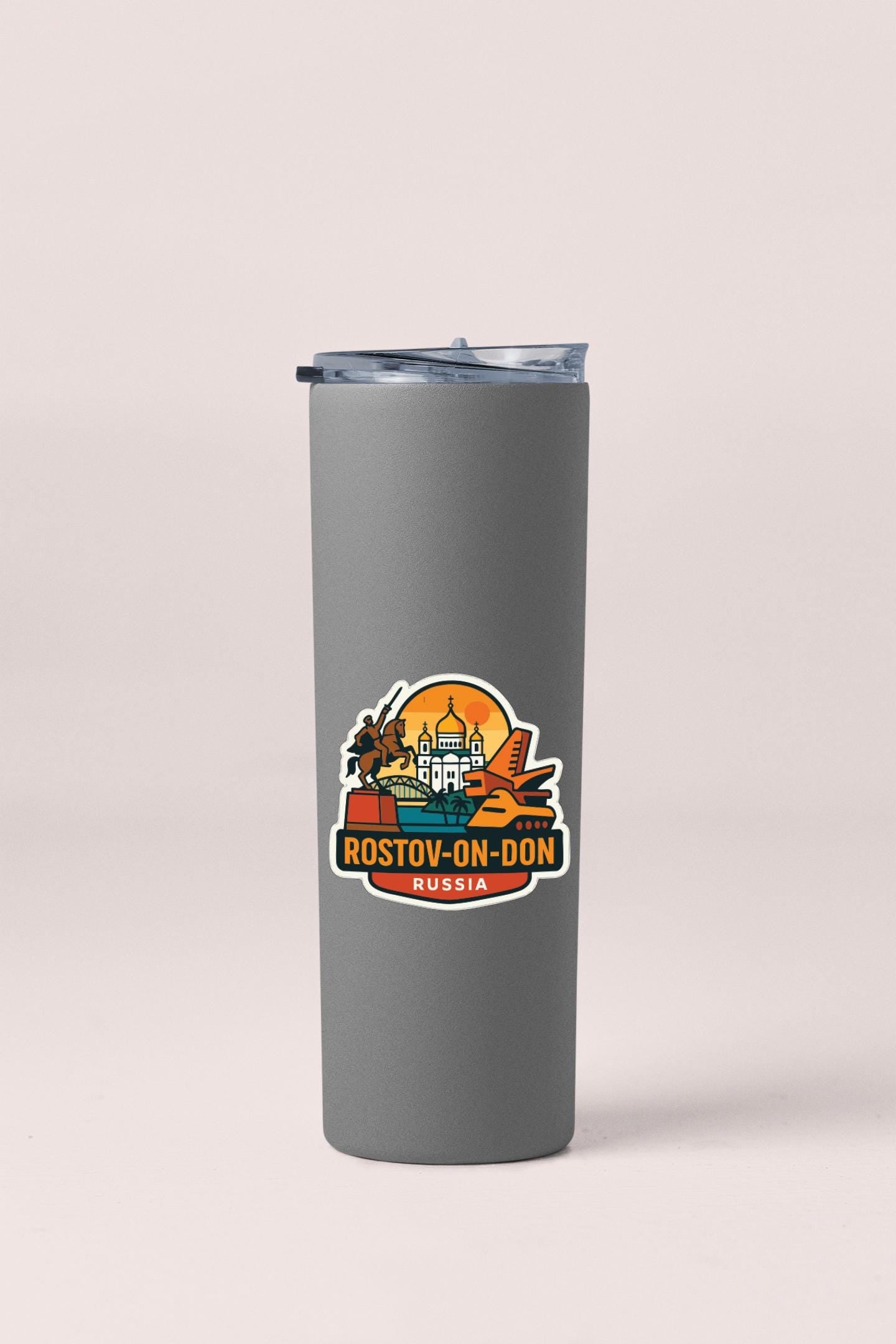 A gray insulated tumbler with a sticker featuring a graphic of a city skyline and the text "ROSTOV-ON-DON RUSSIA".