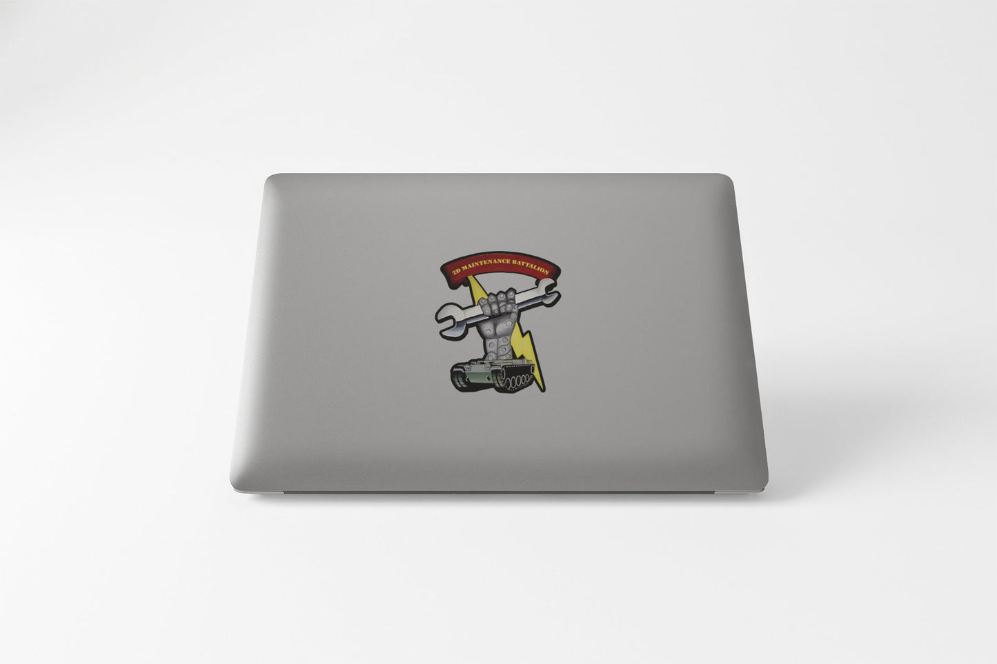 a laptop computer with a sticker of a skateboarder