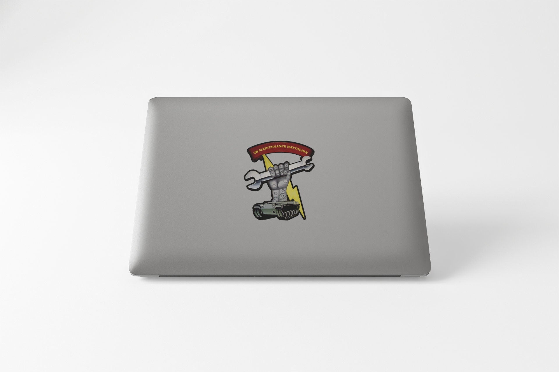 a laptop computer with a sticker of a skateboarder