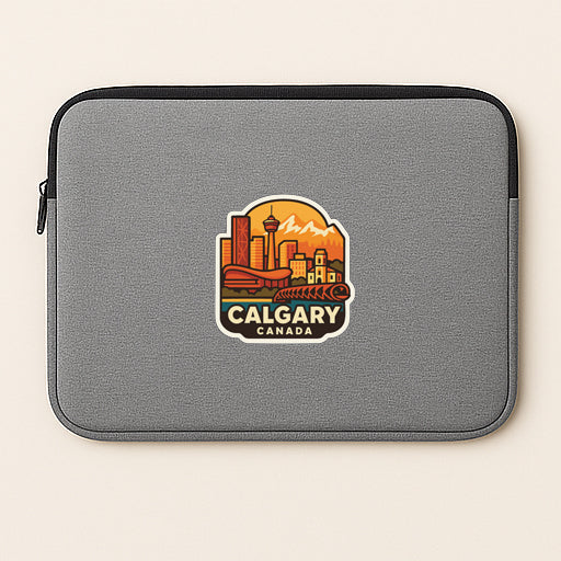 A gray laptop sleeve with a graphic of a city skyline and the text "Calgary, Canada" printed on it.