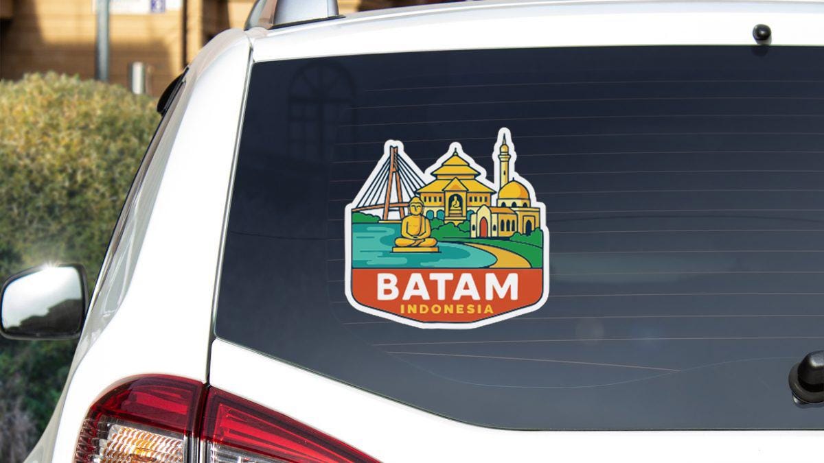 A sticker on the rear window of a car that says "BATAM INDONESIA".