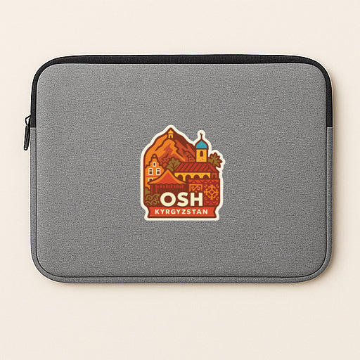 A gray laptop sleeve with a sticker depicting a cityscape and the text "OISH Kyrgyzstan" printed on it.