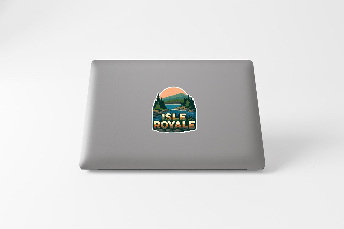 A sticker on the back of a laptop that says "ISLE ROYAL".