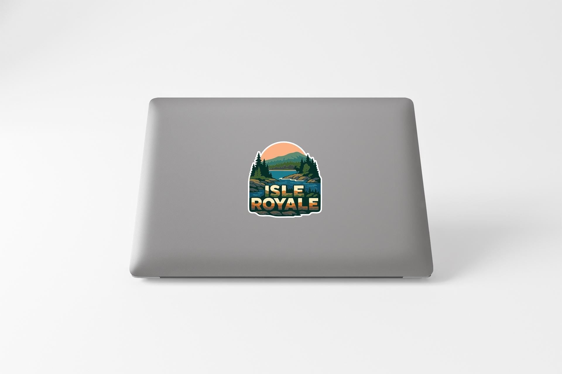 A sticker on the back of a laptop that says "ISLE ROYAL".